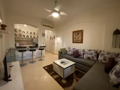 a living room with a couch and a table at Babel Apartments el gouna in Hurghada