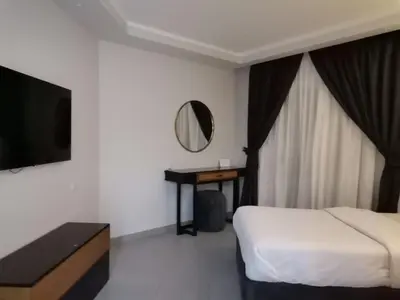 a hotel room with a bed and a mirror at Scandic resort in Hurghada