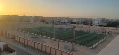 a large soccer field on top of a building at Sunny sky in Quseir