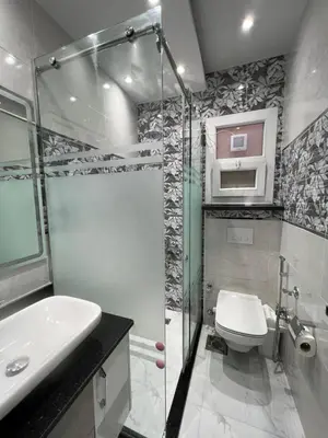 a bathroom with a shower and a toilet and a sink at BS Lodging 16- Next to Dream Beach in Hurghada
