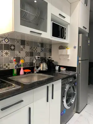 a kitchen with a sink and a dishwasher at BS Lodging 16- Next to Dream Beach in Hurghada