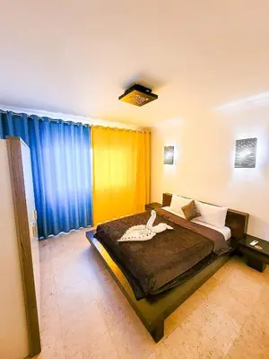 a bedroom with a large bed in a room at Sun Of Marina in Hurghada