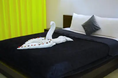 a bedroom with a bed with a white animal on it at Sun Of Marina in Hurghada