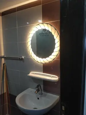 a bathroom with a sink and a mirror on the wall at سيسيليا اتش in Hurghada