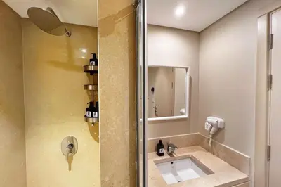 a bathroom with a sink and a shower at Rugged & Relaxed 1 BDR Mangroovy Free Pool & Beach Access in Hurghada