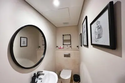a bathroom with a sink and a mirror at Rugged & Relaxed 1 BDR Mangroovy Free Pool & Beach Access in Hurghada