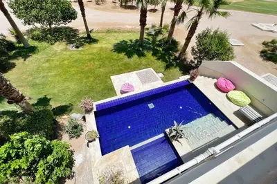 an overhead view of a swimming pool in a house at Meditative & Blissful 2 BDR Villa Ancient Sands Private Pool in Hurghada