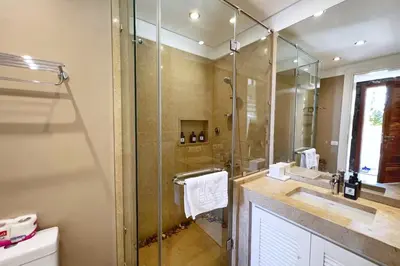 a bathroom with a glass shower and a sink at Meditative & Blissful 2 BDR Villa Ancient Sands Private Pool in Hurghada