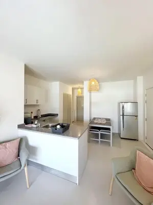 a kitchen with a large island in a room at Lagoonfront Easy 1BDR Swan Lake El Gouna in Hurghada