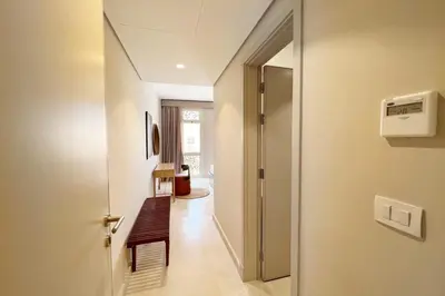 a hallway with a door leading to a room at Dazzling 2 BDR w Rooftop Mangroovy Free Pool & Beach Access in Hurghada