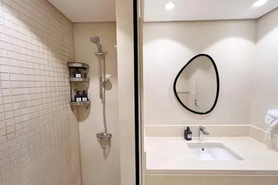 a bathroom with a sink and a mirror at Dazzling 2 BDR w Rooftop Mangroovy Free Pool & Beach Access in Hurghada