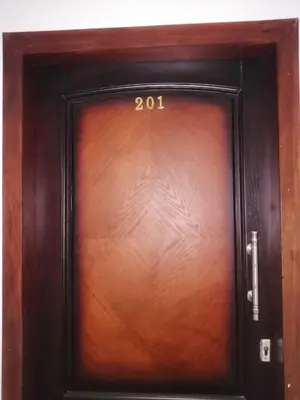 a wooden door with the number on it at B in Hurghada