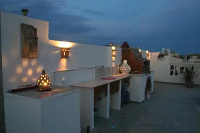 a room with a counter with lights on the wall at A Beautiful, Family-owned Penthouse Apartment, Overlooking the Red Sea Hurghada in Hurghada