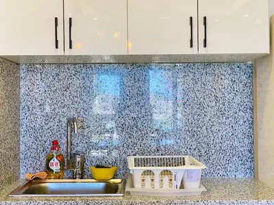 a kitchen sink with white cabinets and a counter top at Brand New 1-BR Apt @West Golf- El Gouna W/ a View! in Hurghada