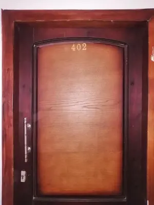 a wooden door with the number on it at 402 A in Hurghada