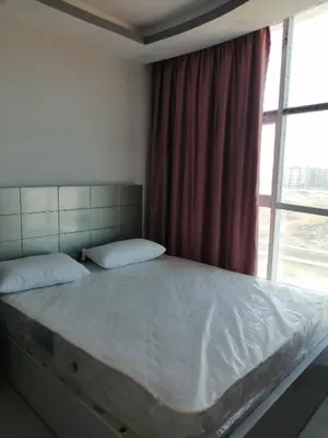 a large bed in a bedroom with a window at 403 A in Hurghada