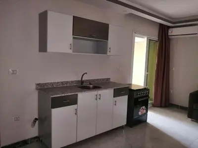 a kitchen with a sink and a counter top at 403 A in Hurghada