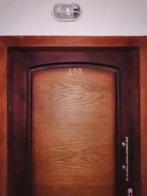 a wooden door with the number on it at 403 A in Hurghada
