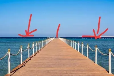 a wooden pier stretches out over the water at Scandic Resort Apartments in Hurghada