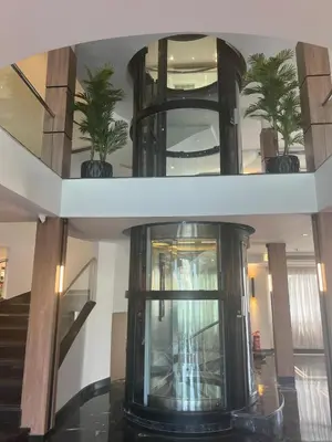 a building with a staircase with potted plants in it at Nile Cruise 5 Stars From Luxor And Aswan 3&4 Nights in Aḑ Ḑab‘īyah