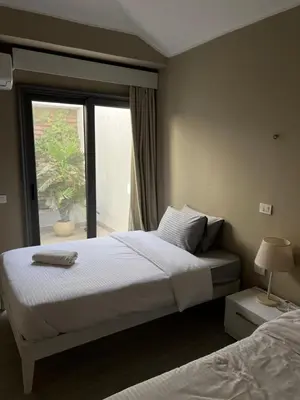 a bedroom with a large bed and a window at 2 Bedroom villa with private heated pool in Gouna in Hurghada