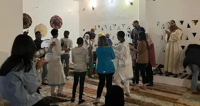a group of people standing in a room at Torya Nubian House in Aswan