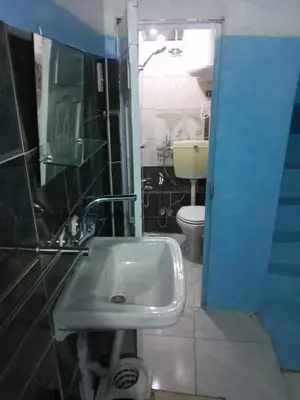a bathroom with a sink and a toilet at Rose house in Aswan