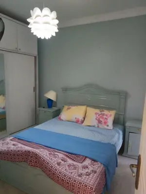 a bedroom with a bed and a chandelier at Hurghada Red Sea in Hurghada