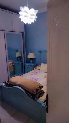 a bedroom with a bed and a large mirror at Hurghada Red Sea in Hurghada