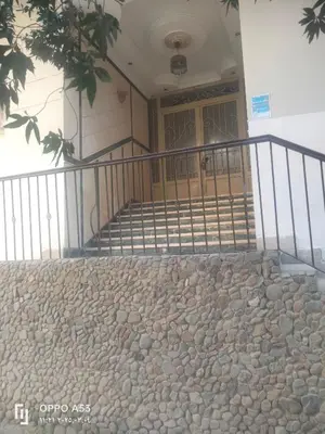 a stone walkway in front of a building with a door at Hurghada Red Sea in Hurghada