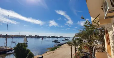 a view of a river with boats in the water at Nile View Panoramique and Garden West bank in Luxor