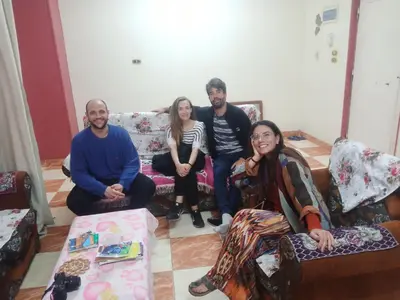 a group of people sitting in a living room at Aswan City Center Guest House in Aswan