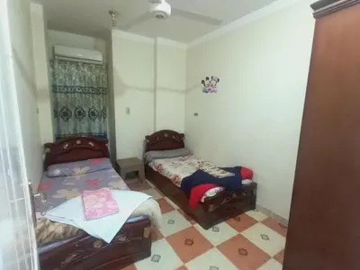a room with two beds in a room at Aswan City Center Guest House in Aswan