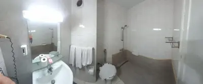 a bathroom with a sink and a toilet at New Pola Hotel in Luxor