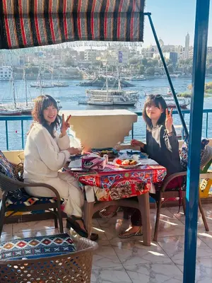 two women sitting at a table on a boat at Airkela Nuba Dool 2 in Aswan