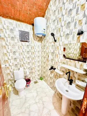 a bathroom with a toilet and a sink at Airkela Nuba Dool 2 in Aswan