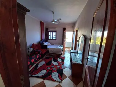 a living room with a couch and a table at Lucky House in Luxor