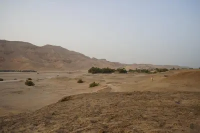 a view of a desert with mountains in the background at Ahmed's House in Luxor
