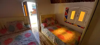 a small bedroom with a bed and a window at Casablanca Guest House in Aswan