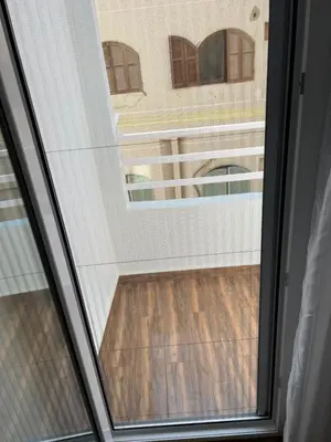 a window with a view of a building at GRACELAND Apartment in Hurghada city centre in Hurghada
