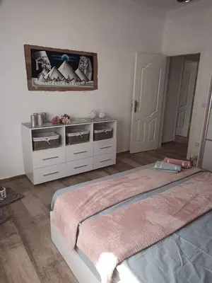a bedroom with a large bed in a room at Alena Lempachova in Hurghada