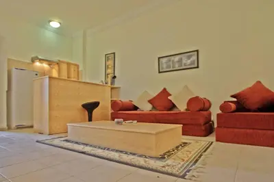 a living room with two couches and a coffee table at L'Oasis de Safaga Hotel in Hurghada