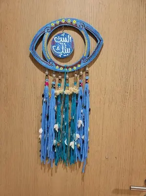 a blue medal hanging on a wall at Mangroovy - 2BR Marvelous Pool View Apartment in Hurghada