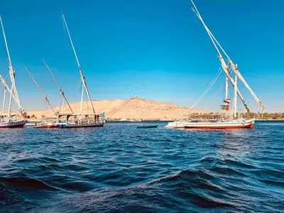 a group of boats sitting in the water at Nile Treasure Cruise - 4 or 7 Nights From Luxor each Saturday and 3 or 7 Nights From Aswan each Wednesday in Luxor