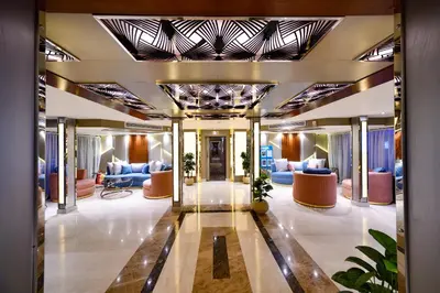 a lobby of a hotel with blue couches at Nile Treasure Cruise - 4 or 7 Nights From Luxor each Saturday and 3 or 7 Nights From Aswan each Wednesday in Luxor