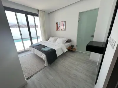 a bedroom with a bed and a large window at 3bedroom apartment with a private pool in Hurghada