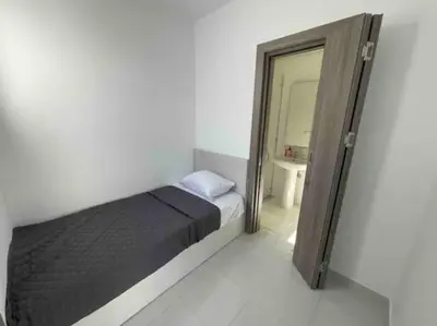 a small bedroom with a bed and a mirror at 3bedroom apartment with a private pool in Hurghada