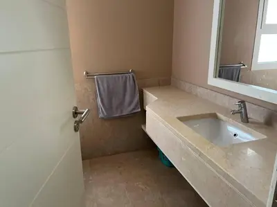 a bathroom with a sink and a mirror at Ground floor two bedrooms in Joubal Lagoon with direct pool access and view in Hurghada