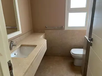 a bathroom with a sink and a toilet at Ground floor two bedrooms in Joubal Lagoon with direct pool access and view in Hurghada