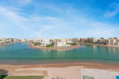 an aerial view of a body of water with buildings at Brand-New Family House in Tawila El Gouna Lagoon and Pool Access in Hurghada
